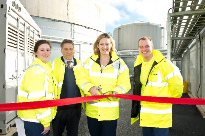 Image shows Amber Rudd MP cutting the tape tp open a new anaerobic digestion plant
