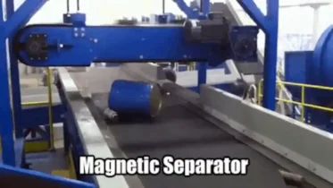 A Magnetic Separator selects a heavy drum and moves it into a metals skip for recycling.