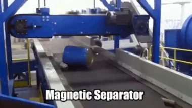 A Magnetic Separator selects a heavy drum and moves it into a metals skip for recycling.