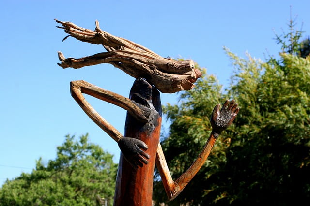 Old recycled wood is used to make a sculpture of a moving figure