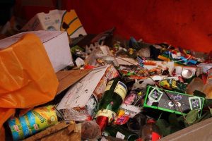 Image shows Typical festival waste lying around a bin. No Zero Waste here!