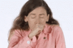 Stop Recycling – It’s a Waste Of Time, Energy And Money? Woman pulls plastic wrapper out of her mouth. Stop Recycling. Don't buy plastic.