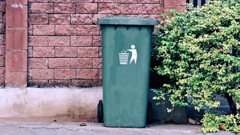 One green trash bin.