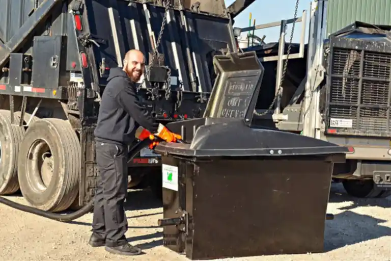 Image shows a Oil and grease collection service in action collecting oil and grease.